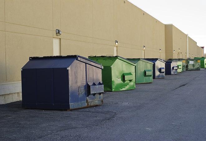 construction dumpsters on a worksite surrounded by caution tape in Blaine, MN